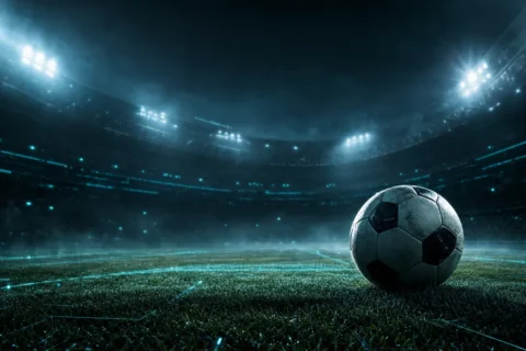 Estadio de fútbol iluminado de noche